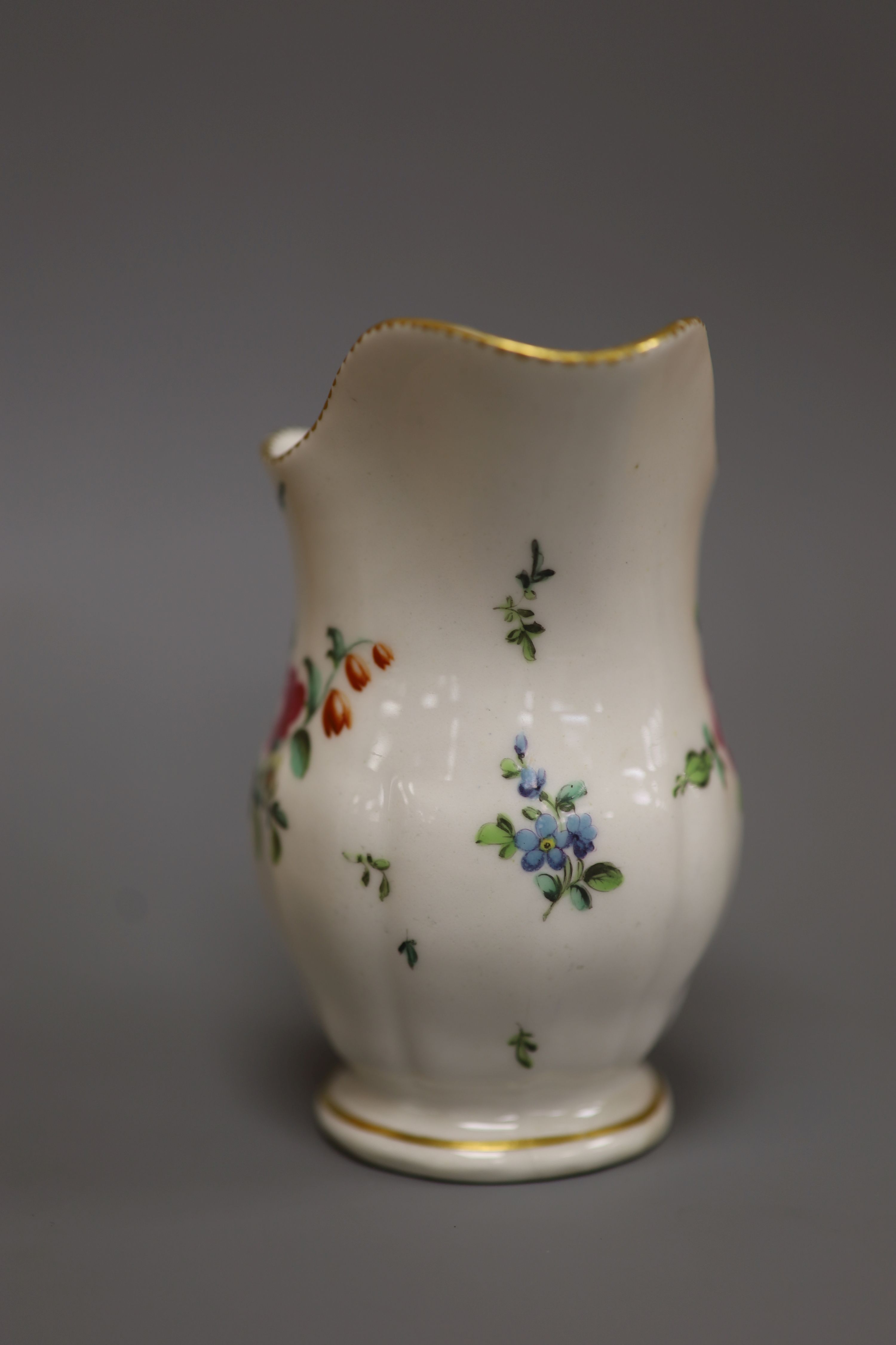 A Derby moulded jug, painted with flowers in manner of Edward Withers, c.1772, height 12cm